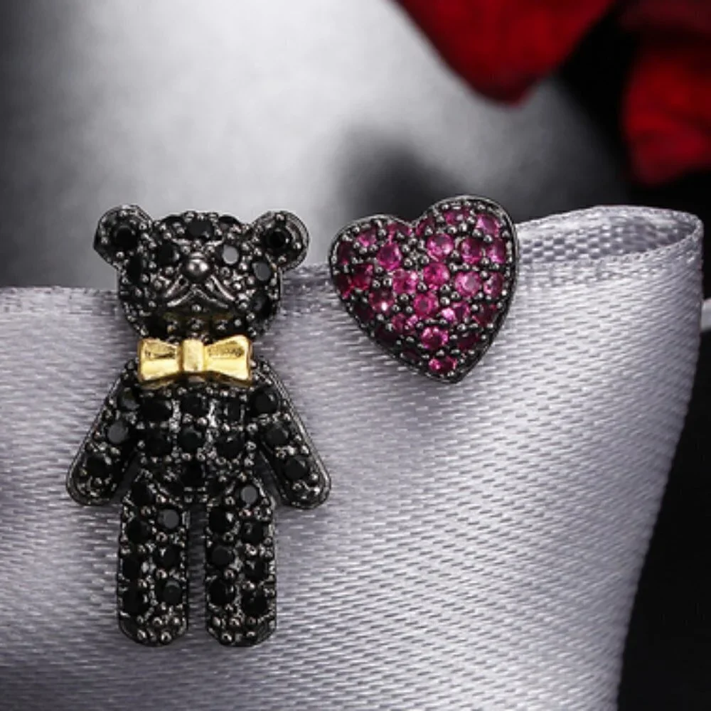Asymmetrical Bear & heart crystal earrings…
